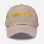 Professional drone pilot wearing Drone Pilot Logo Hat - Aviation equipment for certified UAV operators